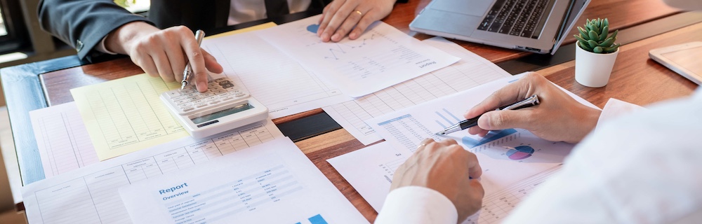 business corporate team brainstorming planning strategy having a discussion analysis investment researching with chart at office his desk documents and saving concept