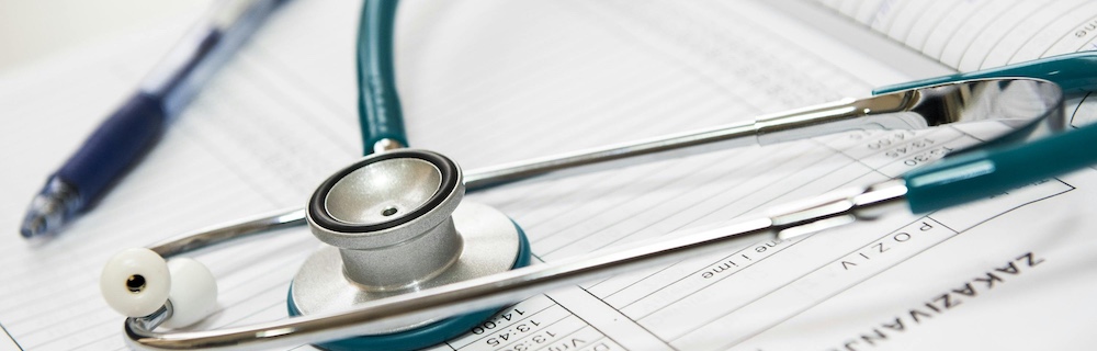 stethiscope and medical papers