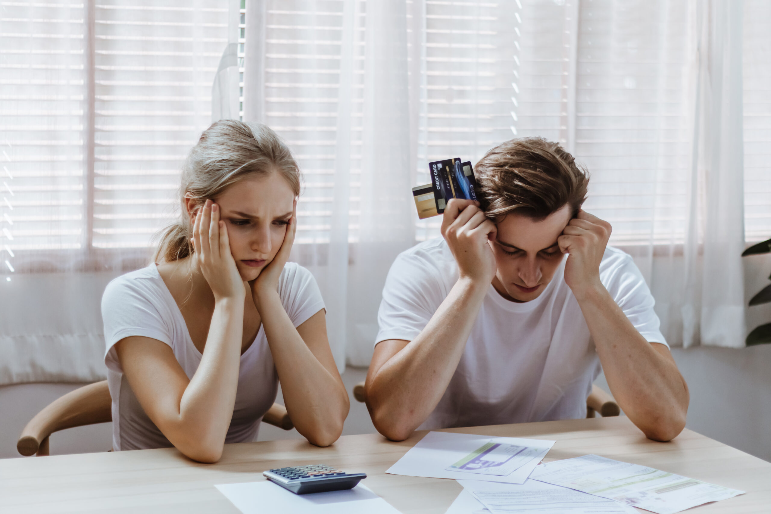 Stressed & unhappy couple conflict of credit card bill